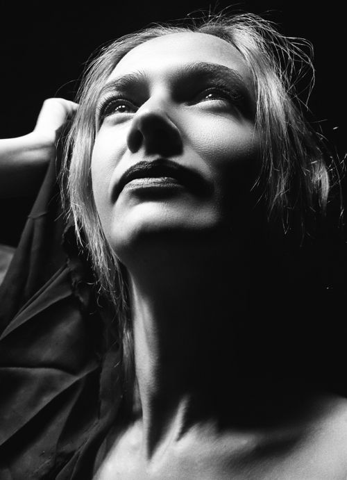 Free Moody black and white portrait capturing a woman's thoughtful expression. Stock Photo