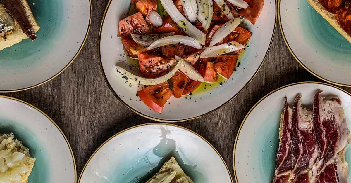 A platter of colorful Spanish tapas dishes arranged on a table.