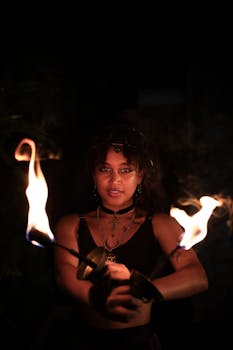 A captivating fire performer showcasing skills at night in São Paulo.
