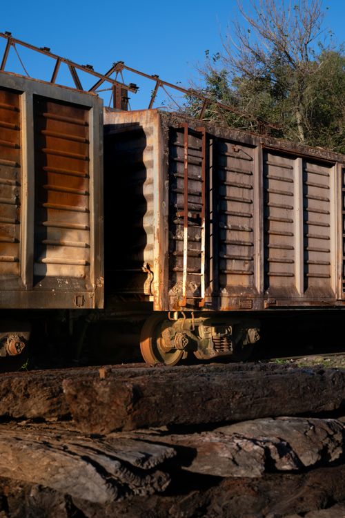 Free Old train car in Villa Lía, Argentina, captured during sunset showcasing its rustic charm and textures. Stock Photo