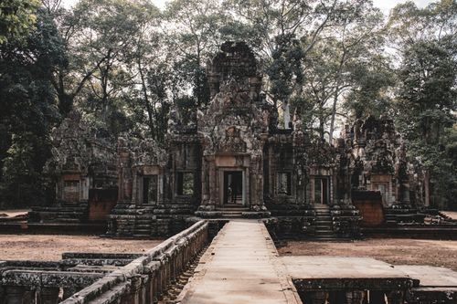 Free Explore the serene beauty of an ancient Cambodian temple set amidst lush greenery in Siem Reap. Stock Photo