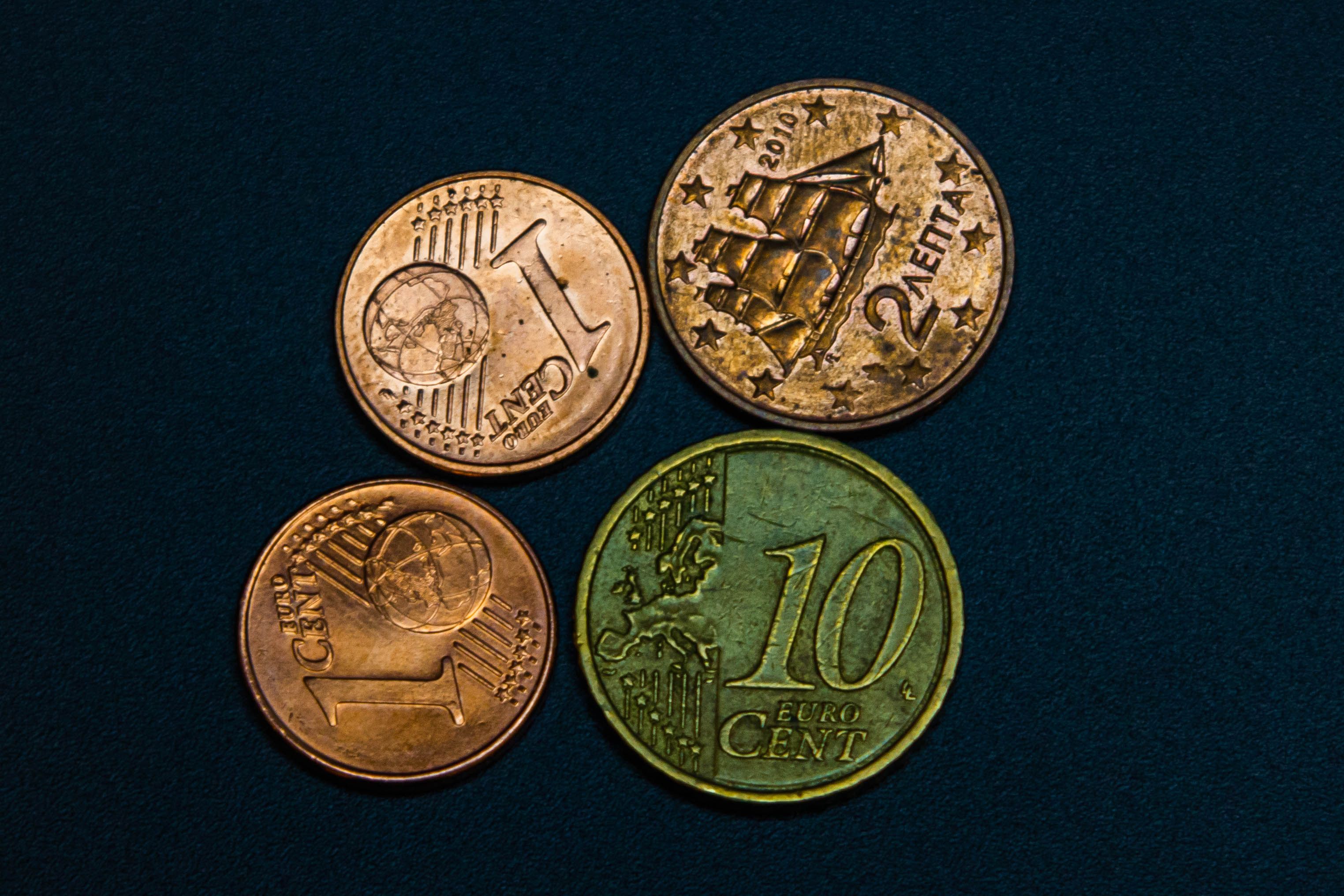Euro Coins on Dark Surface in Flat Lay Display · Free Stock Photo