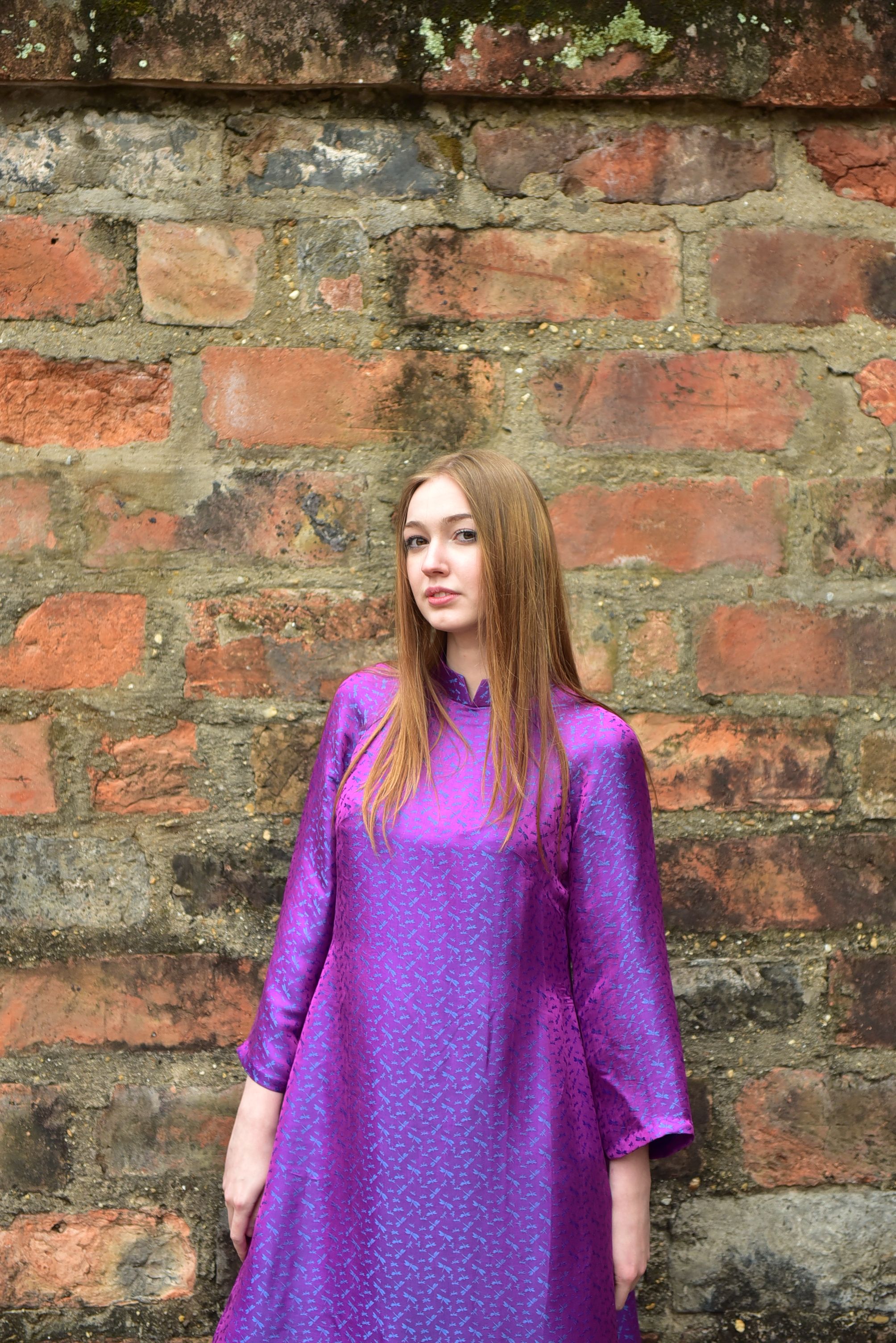 Portrait of Woman in Vibrant Purple Dress · Free Stock Photo