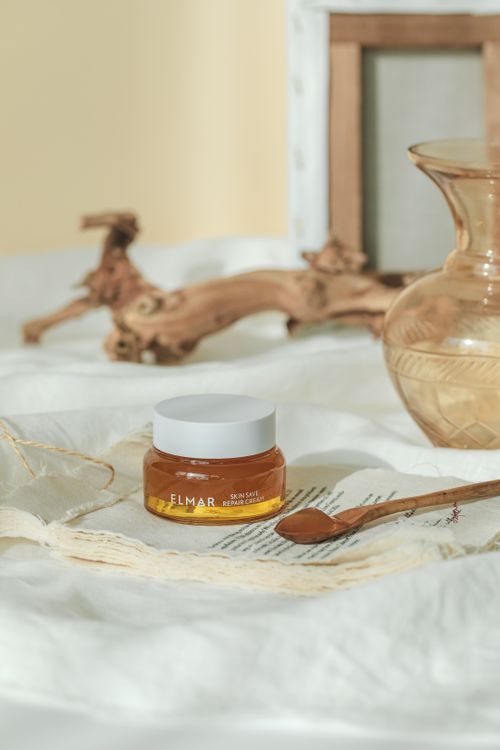 Free Organic skincare cream jar on a rustic arrangement with wooden spoon and glass jar, in soft light. Stock Photo