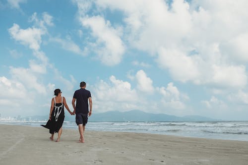 Free Couple Walking At The Beach Stock Photo