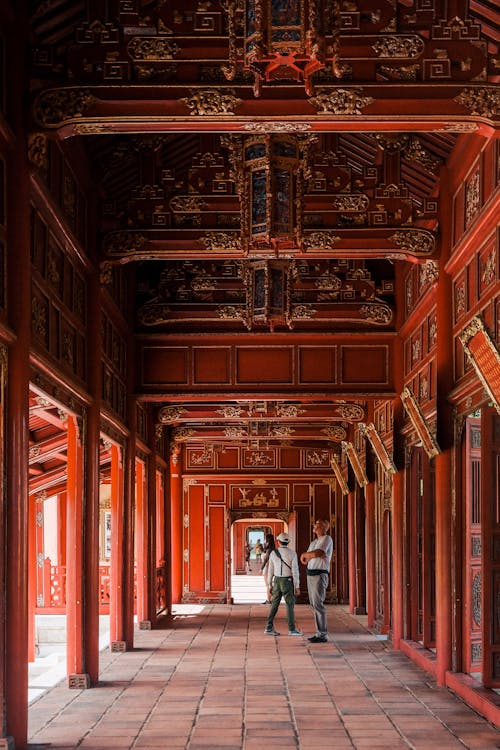 Photo of People Standing in Hallway