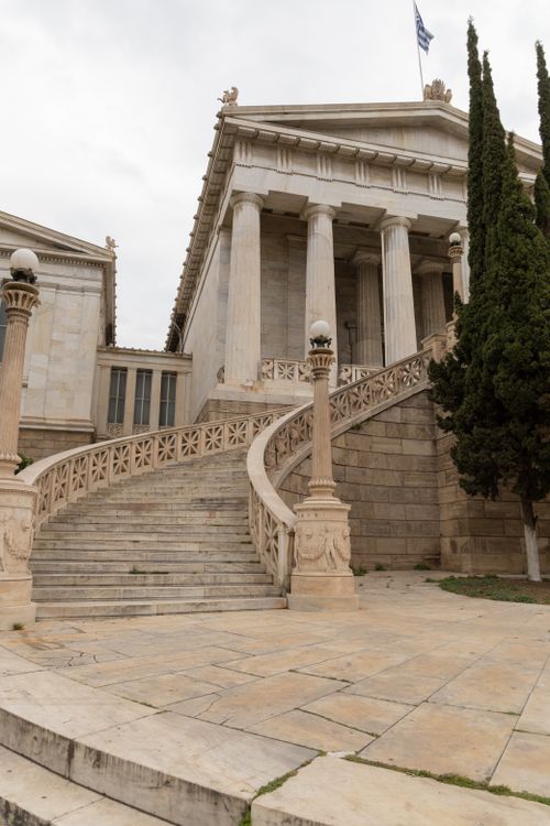 Free Impressive neoclassical architecture with grand staircase and columns. Stock Photo