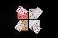 Colorful Terrazzo Patterned Envelopes on Black