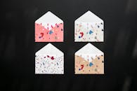 Colorful Patterned Envelopes on Black Background
