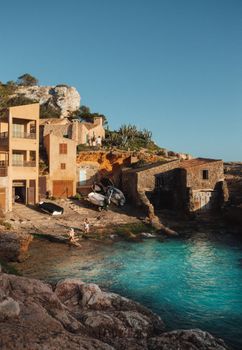 Explore the scenic beauty of Cap des Moró, Majorca with crystal clear waters and picturesque cliffs.