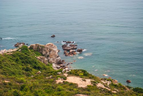 Free Aerial view of rocky coastline and blue sea in Shenzhen, China. Stock Photo
