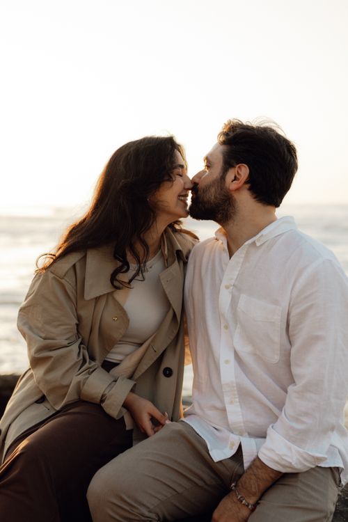 Romantic Couple Embracing at Sunset Beach · Free Stock Photo