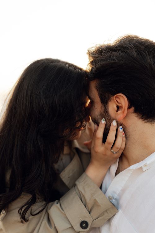 Free Close-up of a couple embracing tenderly outdoors, conveying love and connection. Stock Photo
