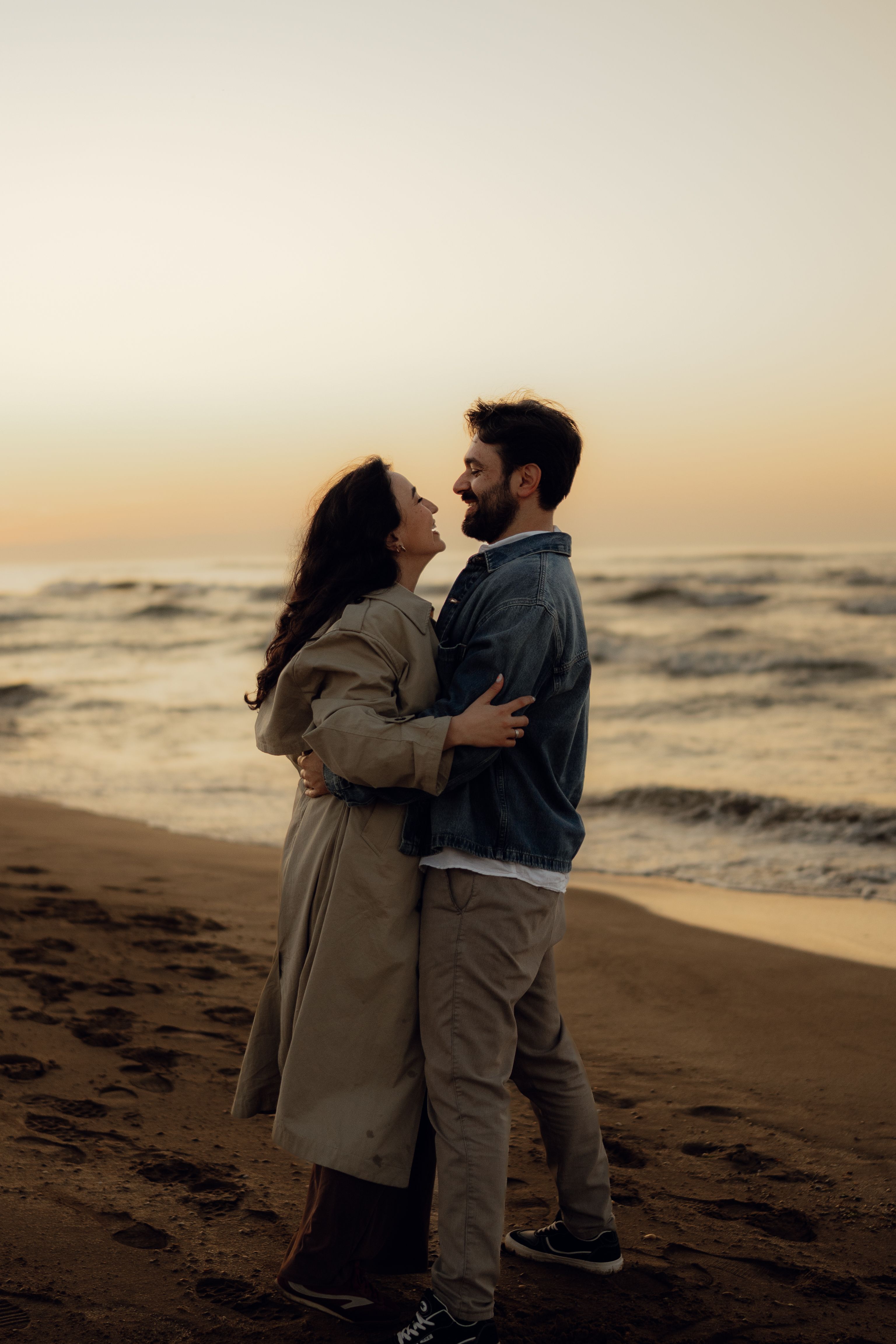 Romantic Couple Embracing on Beach at Sunset · Free Stock Photo