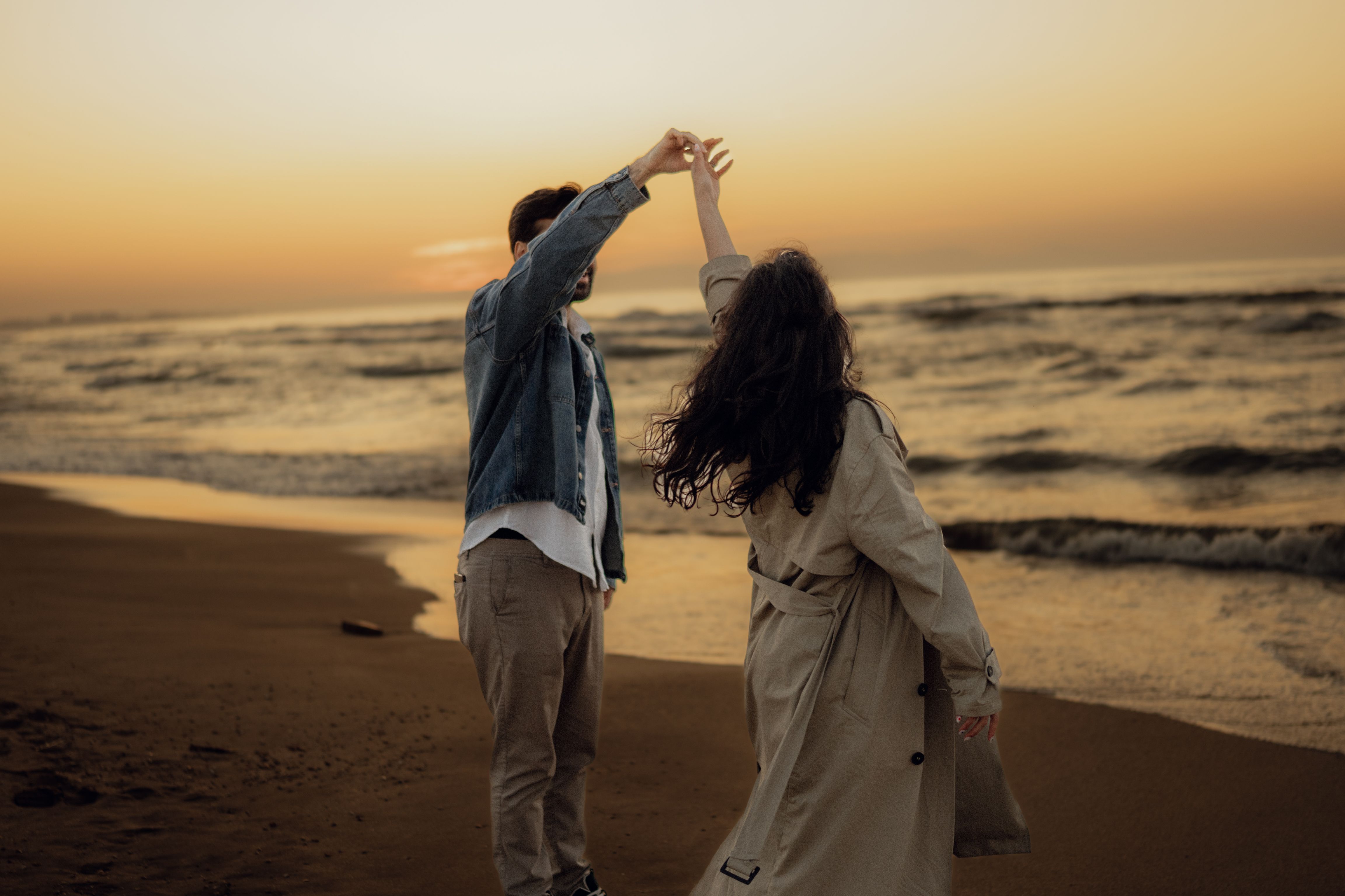 Romantic Couple Dancing at Sunset Beach · Free Stock Photo