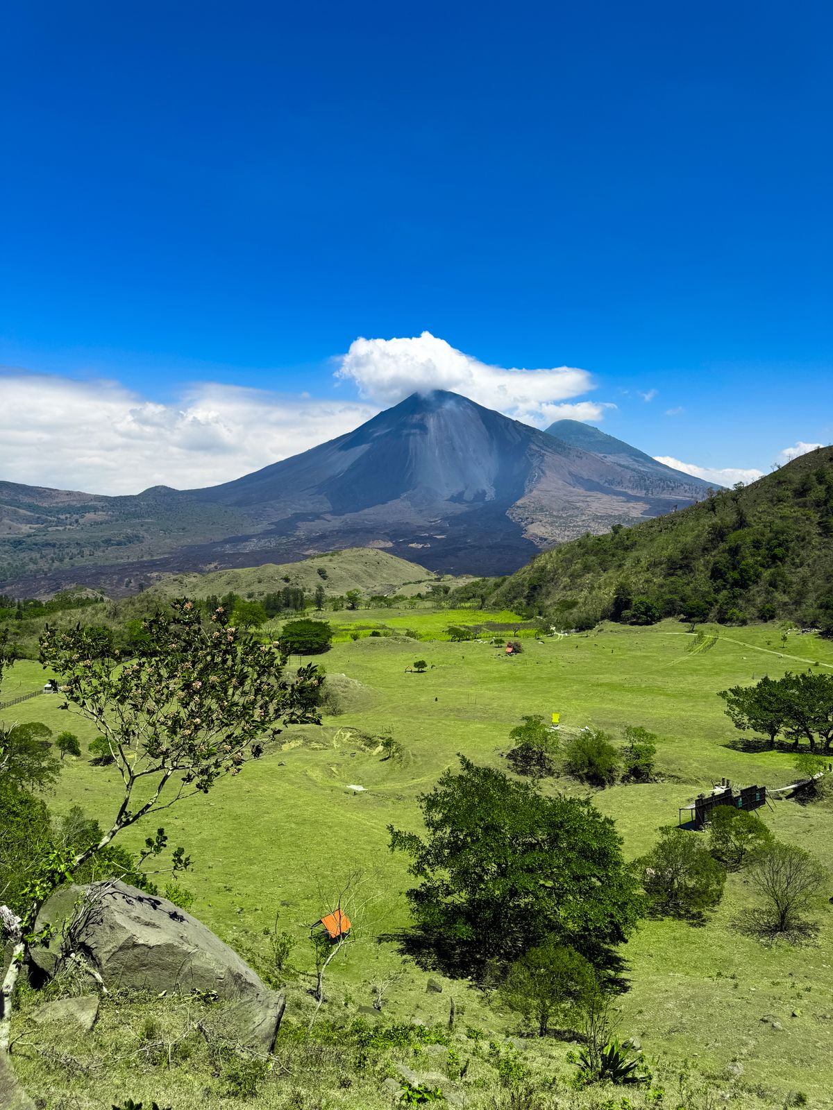 Scenic view of a volcanic peak with green landscape in Japan, similar to Mount Aso