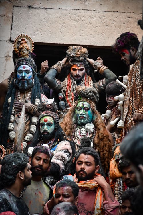 Free Vibrant festival gathering with colorful painted faces and traditional attire. Stock Photo