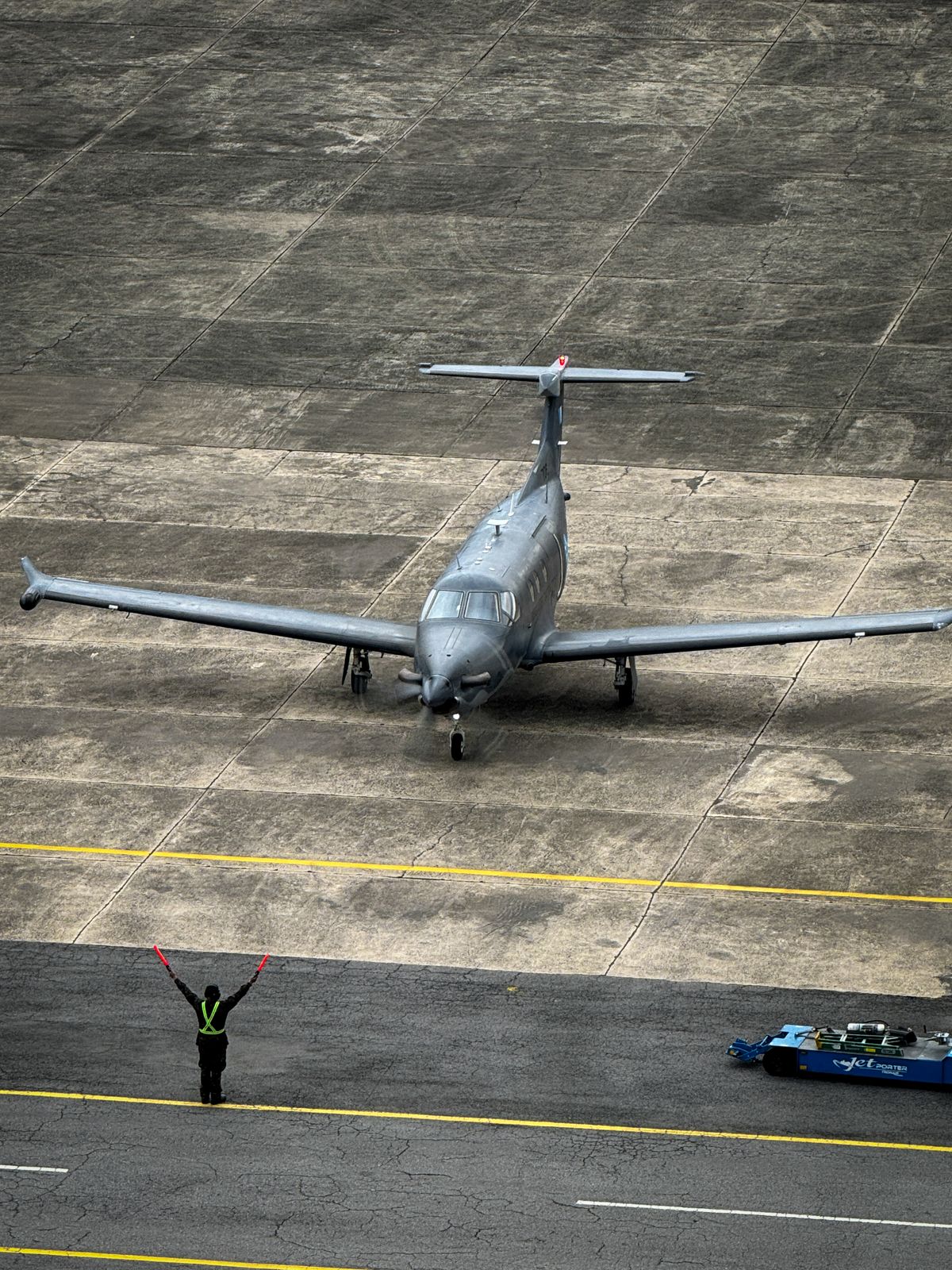 A private jet on the runway from above
