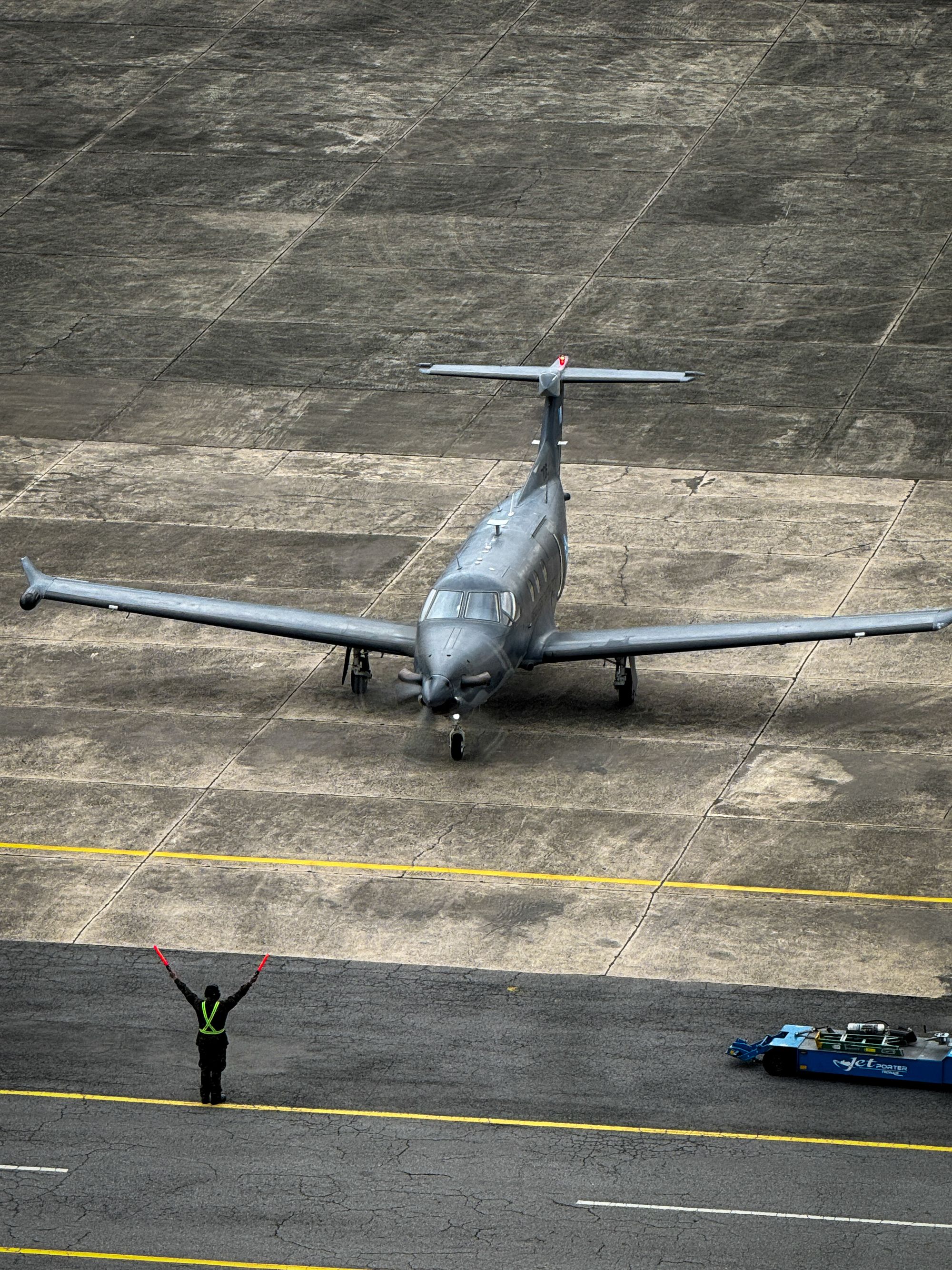 A private jet on the runway from above