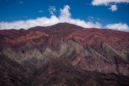 Vibrant mountain landscape in Jujuy, Argentina, showcasing colorful sedimentary rock formations.