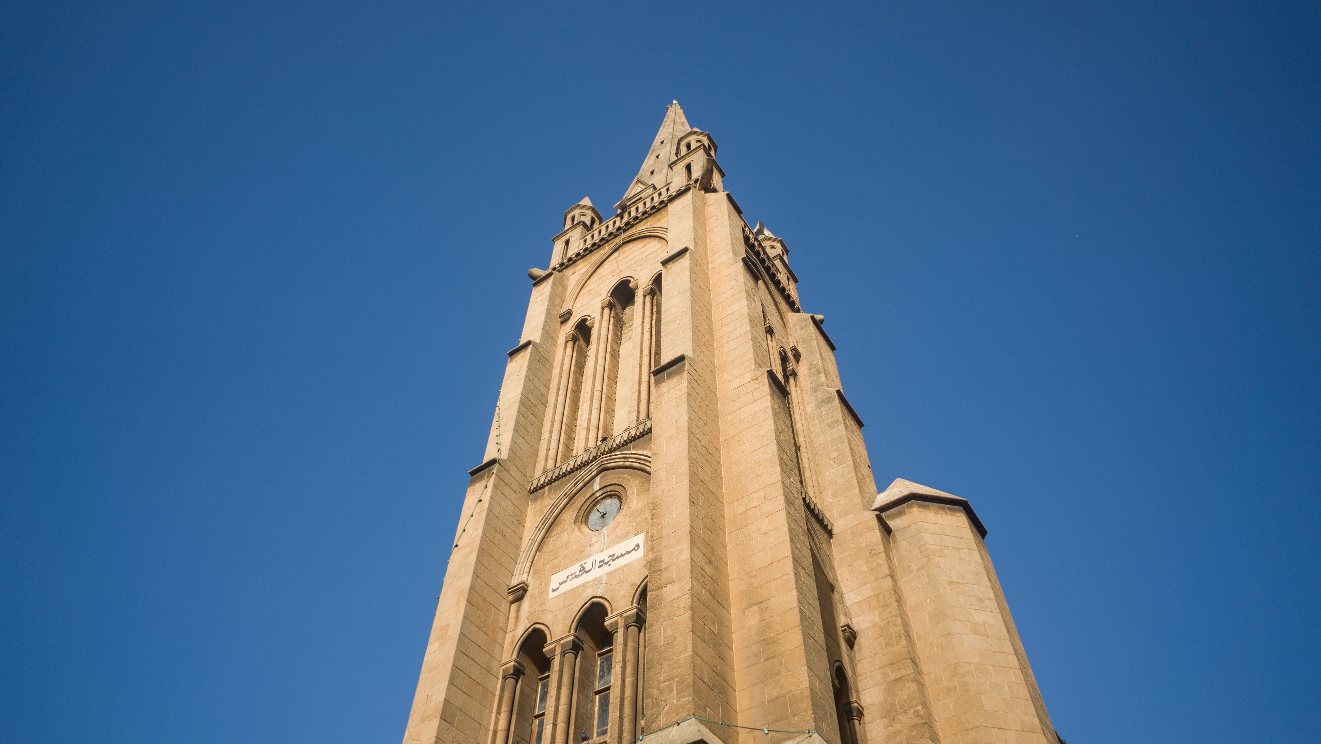 Historic Church Tower Against Clear Blue Sky · Free Stock Photo