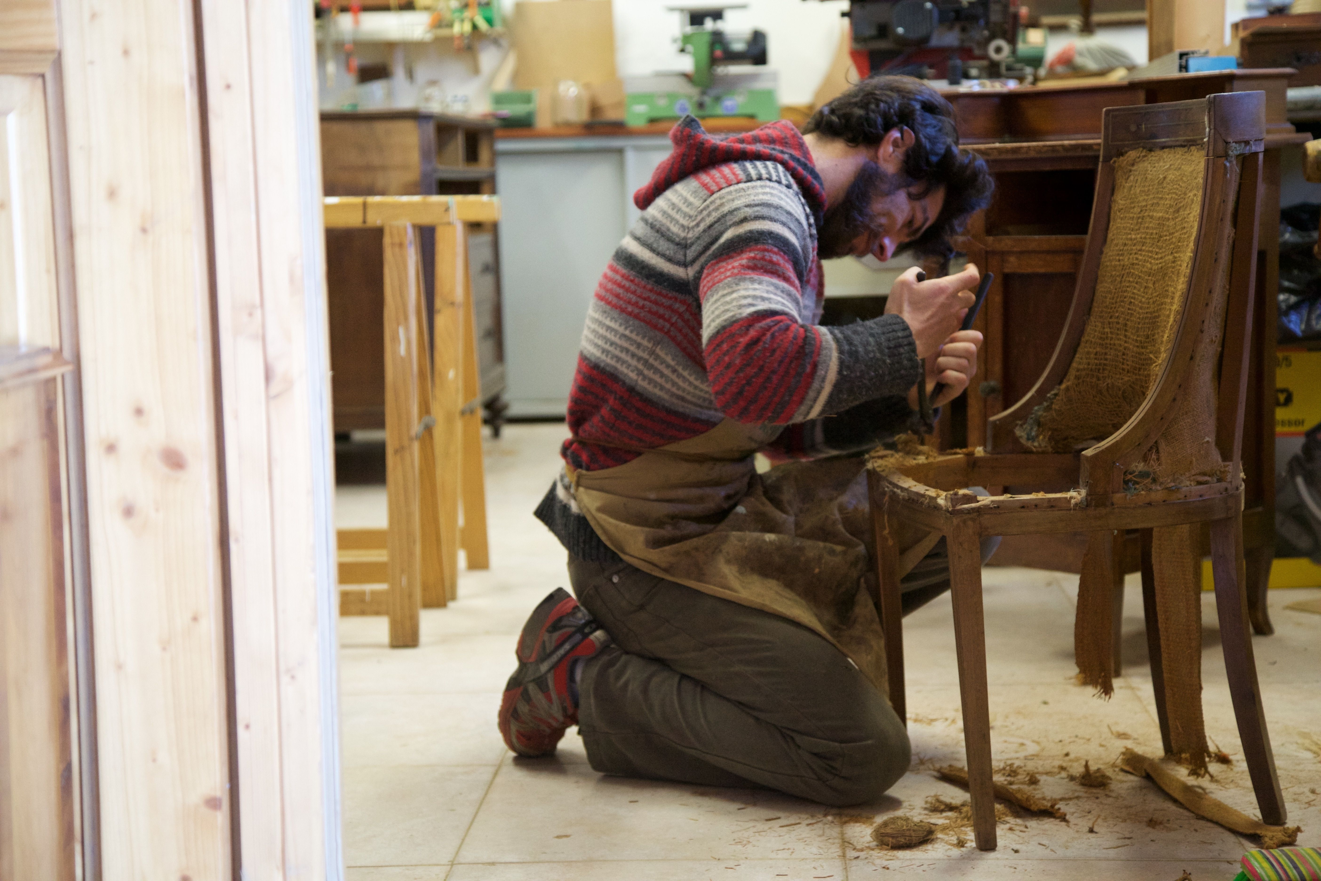 Curated visual reference: Gallery Detail: Craftsman Restoring Antique Wooden Chair