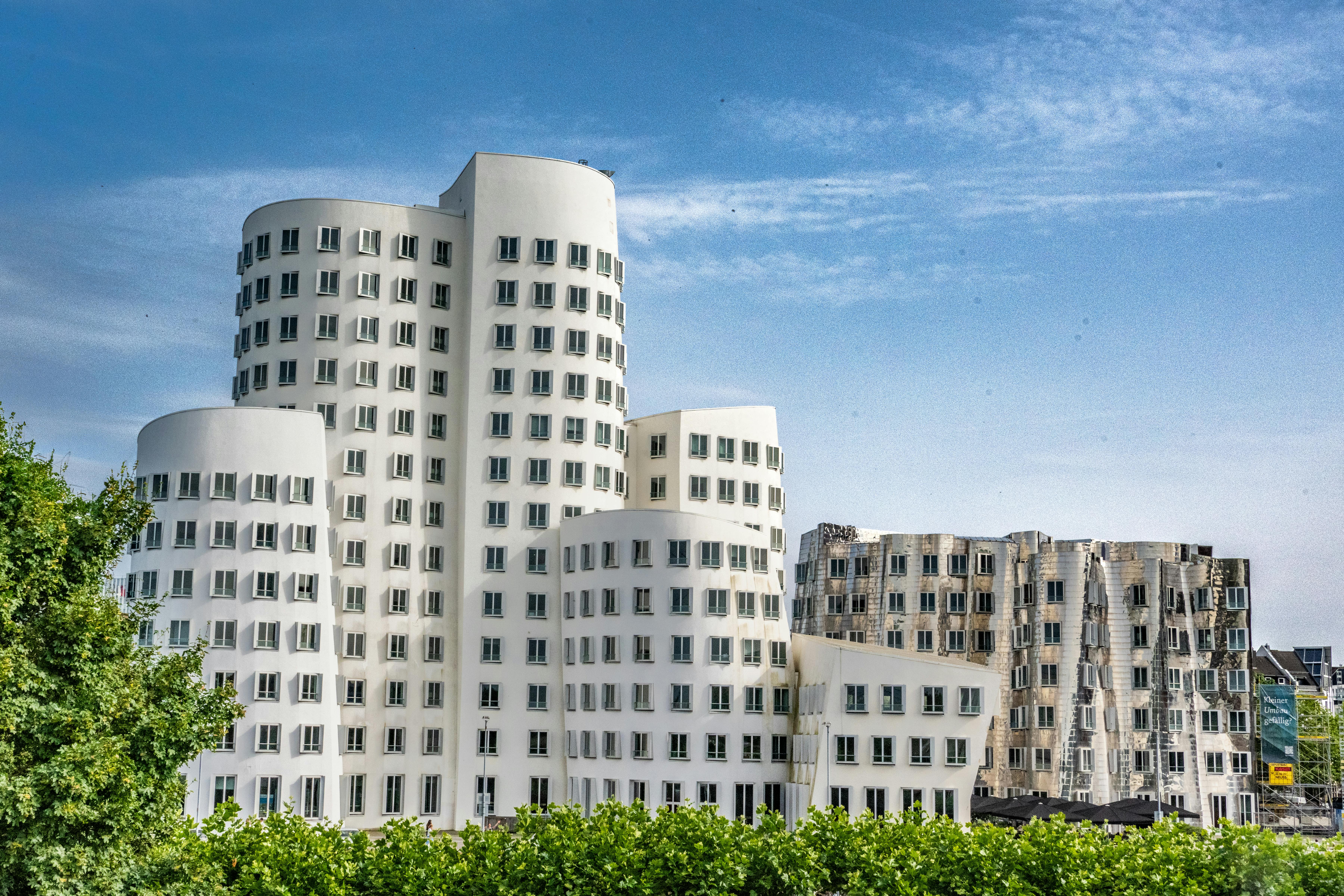 Contemporary buildings in Düsseldorf showcasing unique modern architecture against a clear sky.