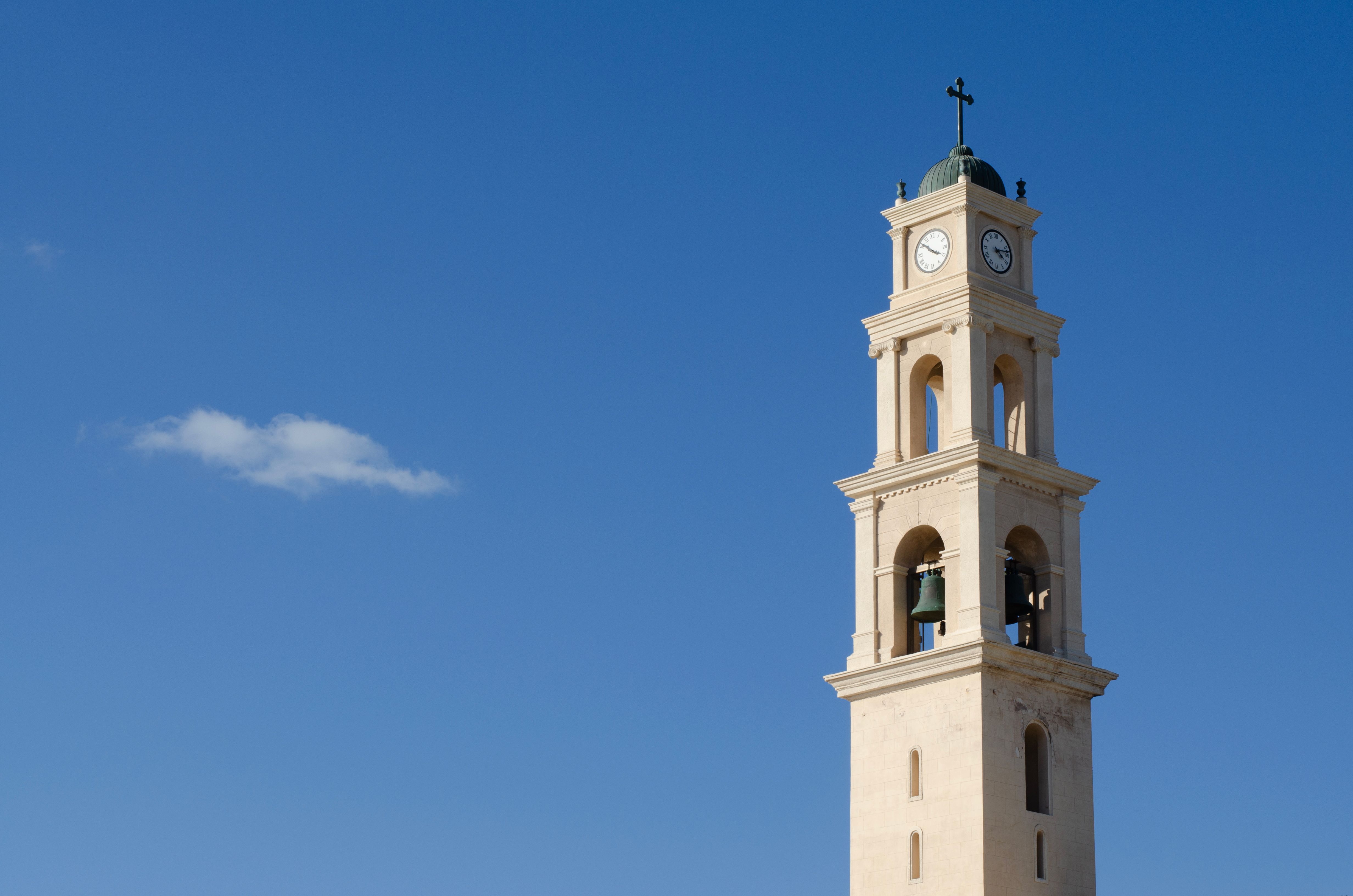 Historic Bell Tower Against Clear Blue Sky · Free Stock Photo