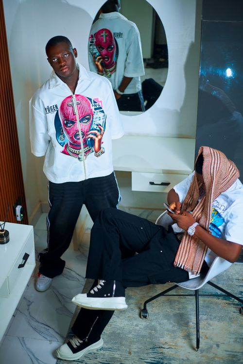 Free Two young adults in urban fashion inside a stylish room. Stock Photo