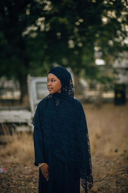 Free Serene woman in hijab standing outdoors, embracing tranquility. Stock Photo