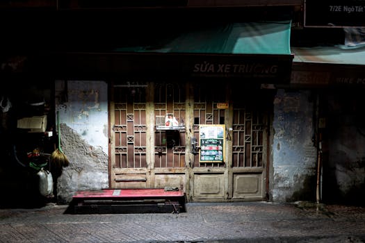 Explore a charming nighttime view of a rustic Vietnamese shop in Ho Chi Minh City.