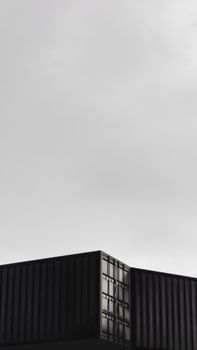 A sleek modern building with dark panels under an overcast sky in Atibaia, Brazil.