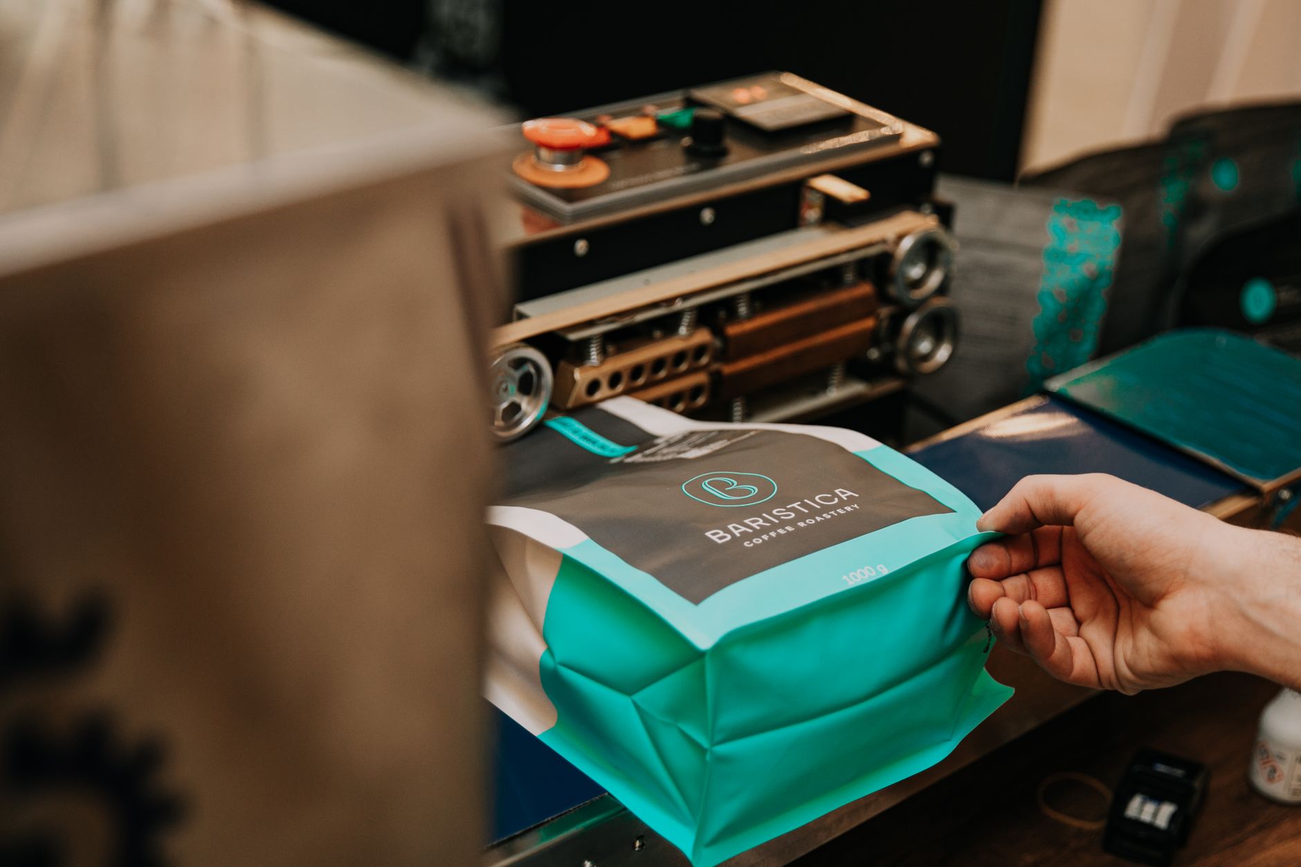 Packing fresh coffee with craft equipment