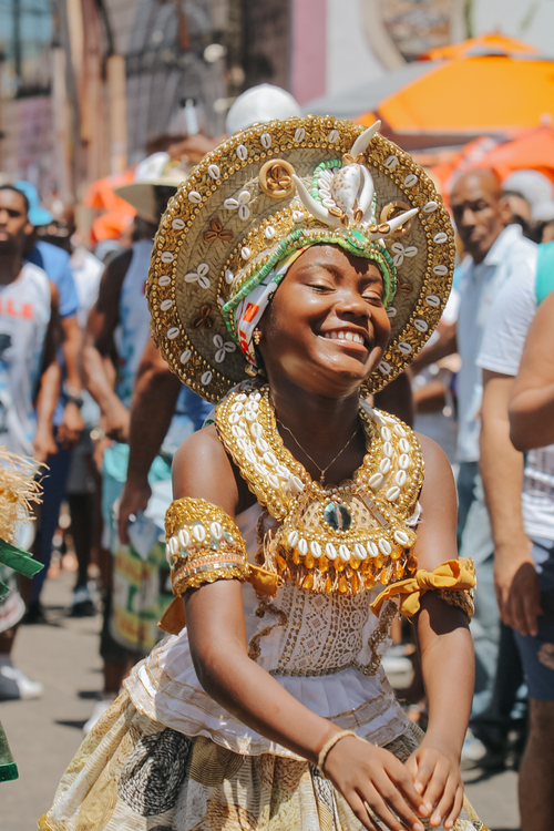 Free Young woman in traditional costume celebrates Afro-Brazilian culture in Salvador, Brazil. Stock Photo