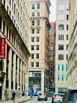 A rainy day in the city showcasing historic architecture on Milk Street.