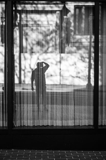 A mysterious silhouette reflected in a window in Portland, Oregon.
