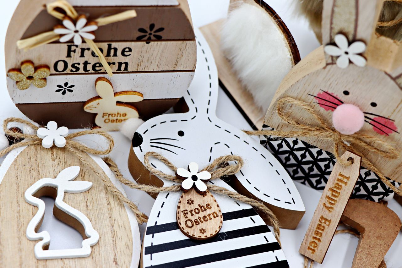 rustic wooden easter decor featuring bunnies eggs and floral elements