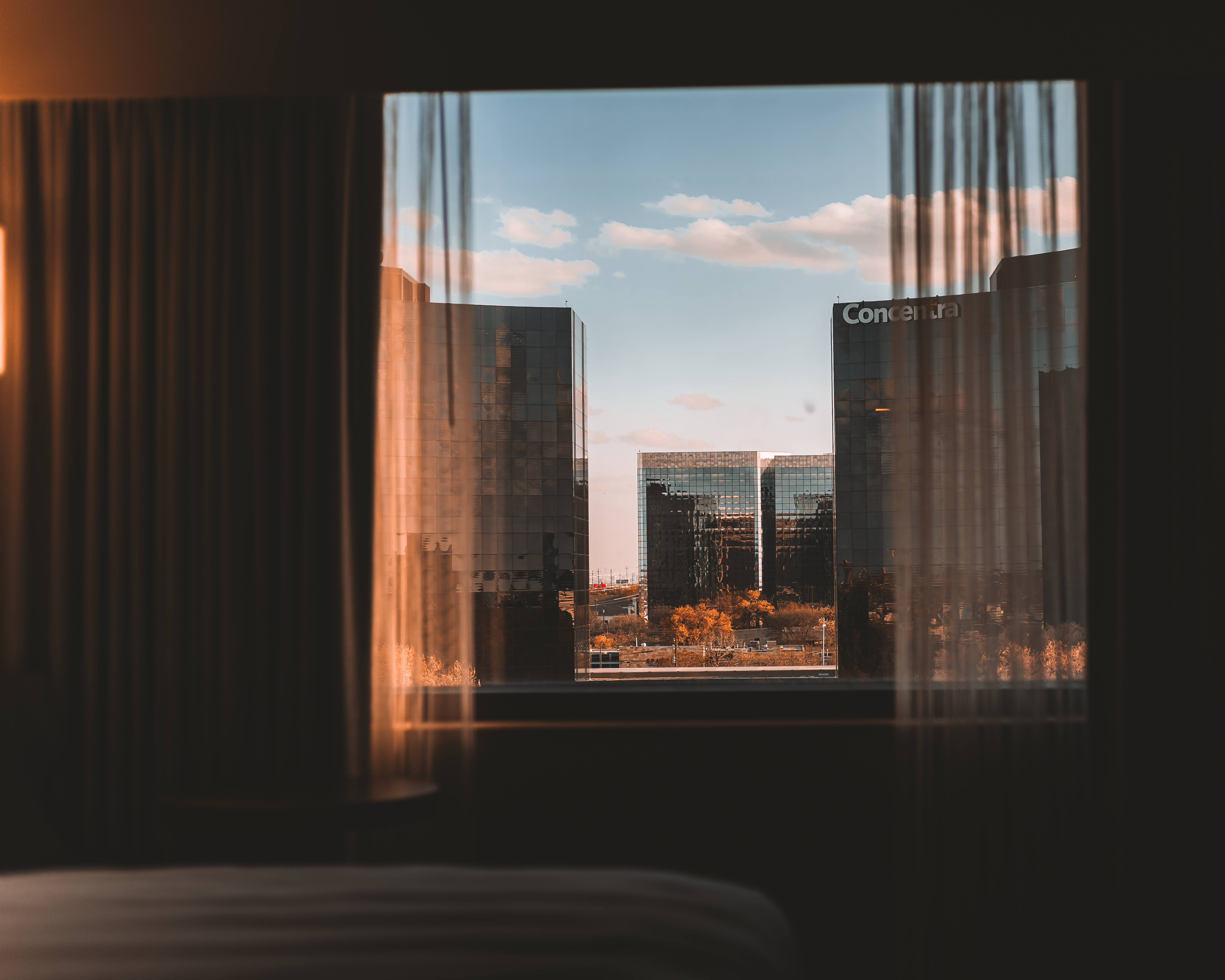 Urban Cityscape Viewed Through Window Frame · Free Stock Photo
