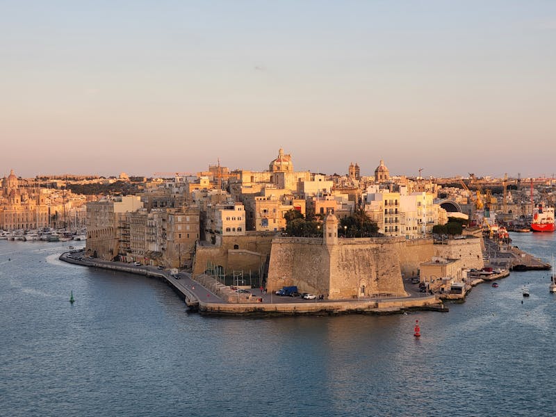 Golden hour sunset view over Valletta Malta waterfront