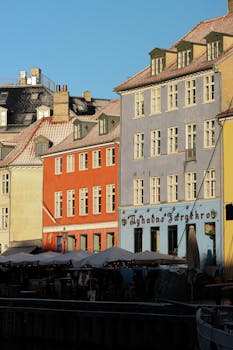 Vibrant historic buildings along the Nyhavn canal in Copenhagen, Denmark.