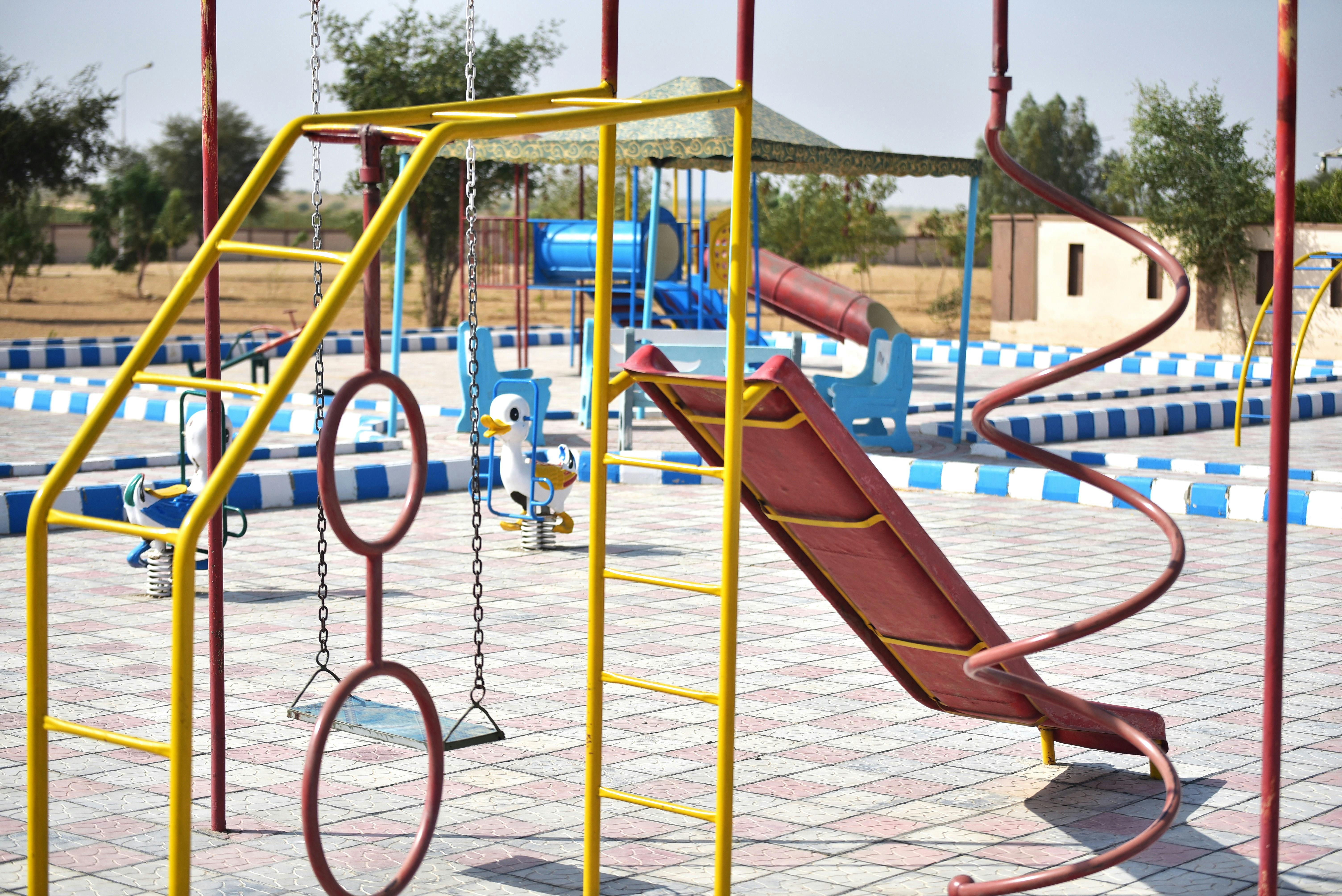 DreamPlay turf playground installation with colorful play equipment - Artificial grass for playgrounds