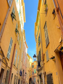 A picturesque alleyway with colorful buildings in a historic European city.