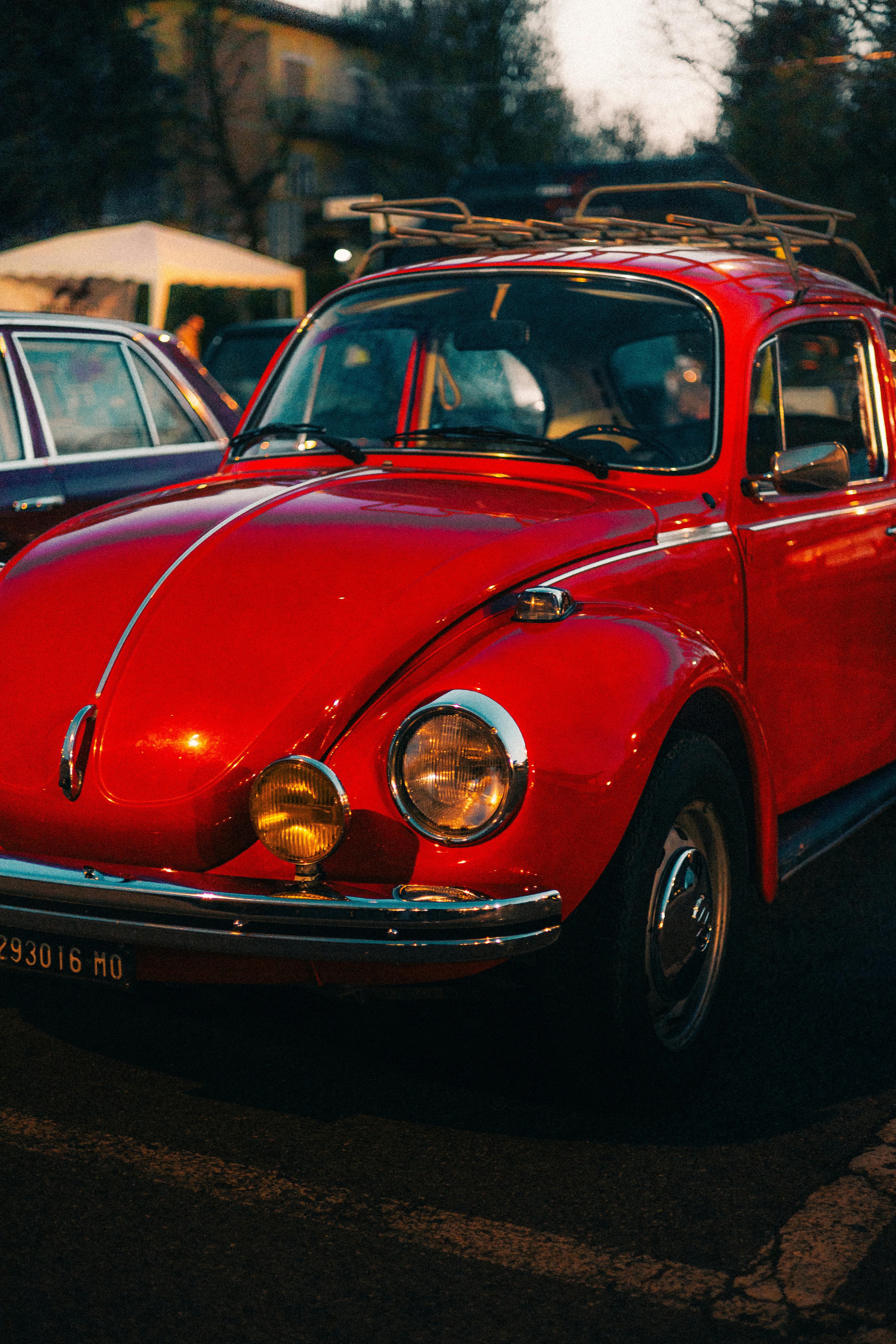 classic red volkswagen beetle at dusk