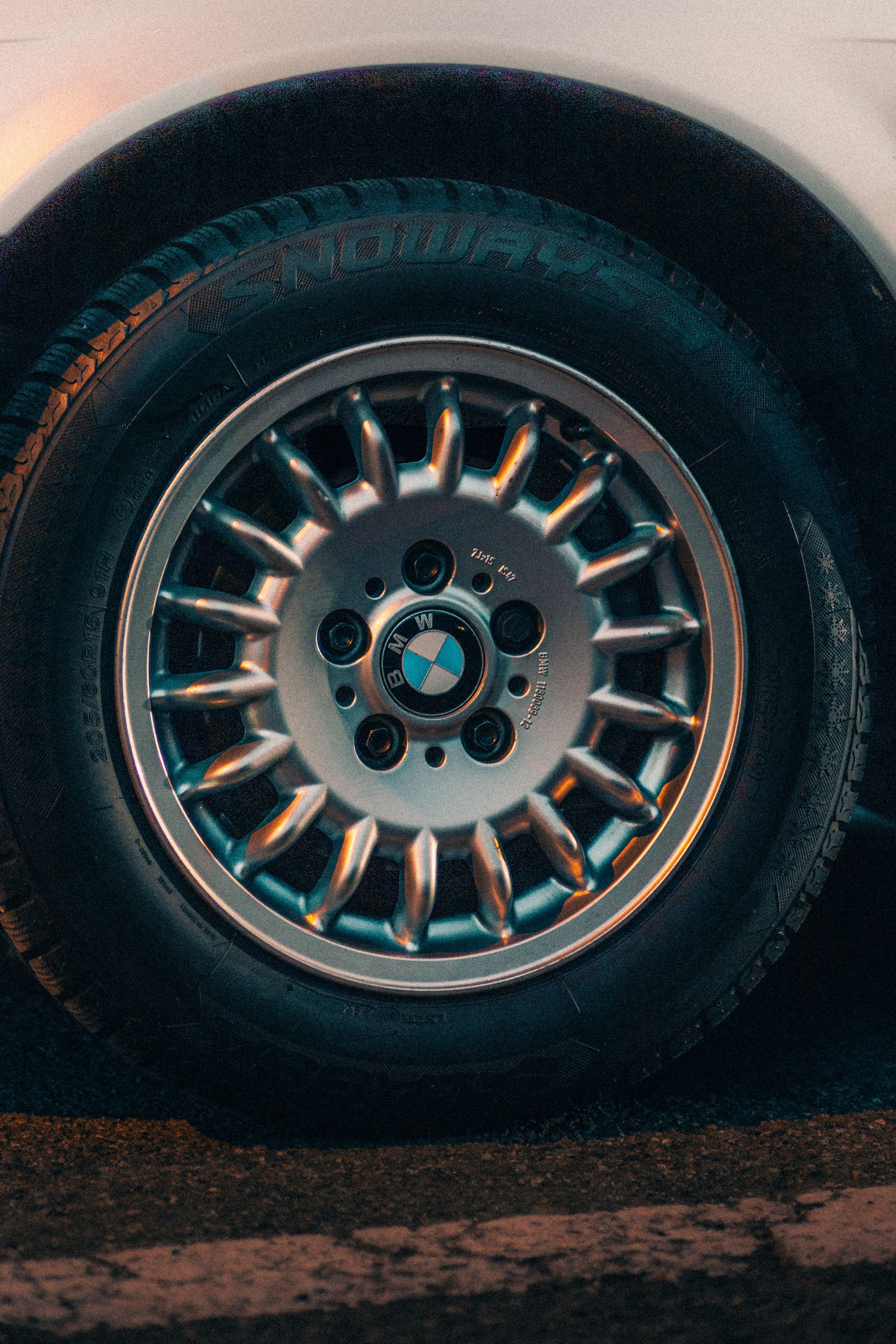 Close-up of the Nomad 321's alloy wheel and tire on the road