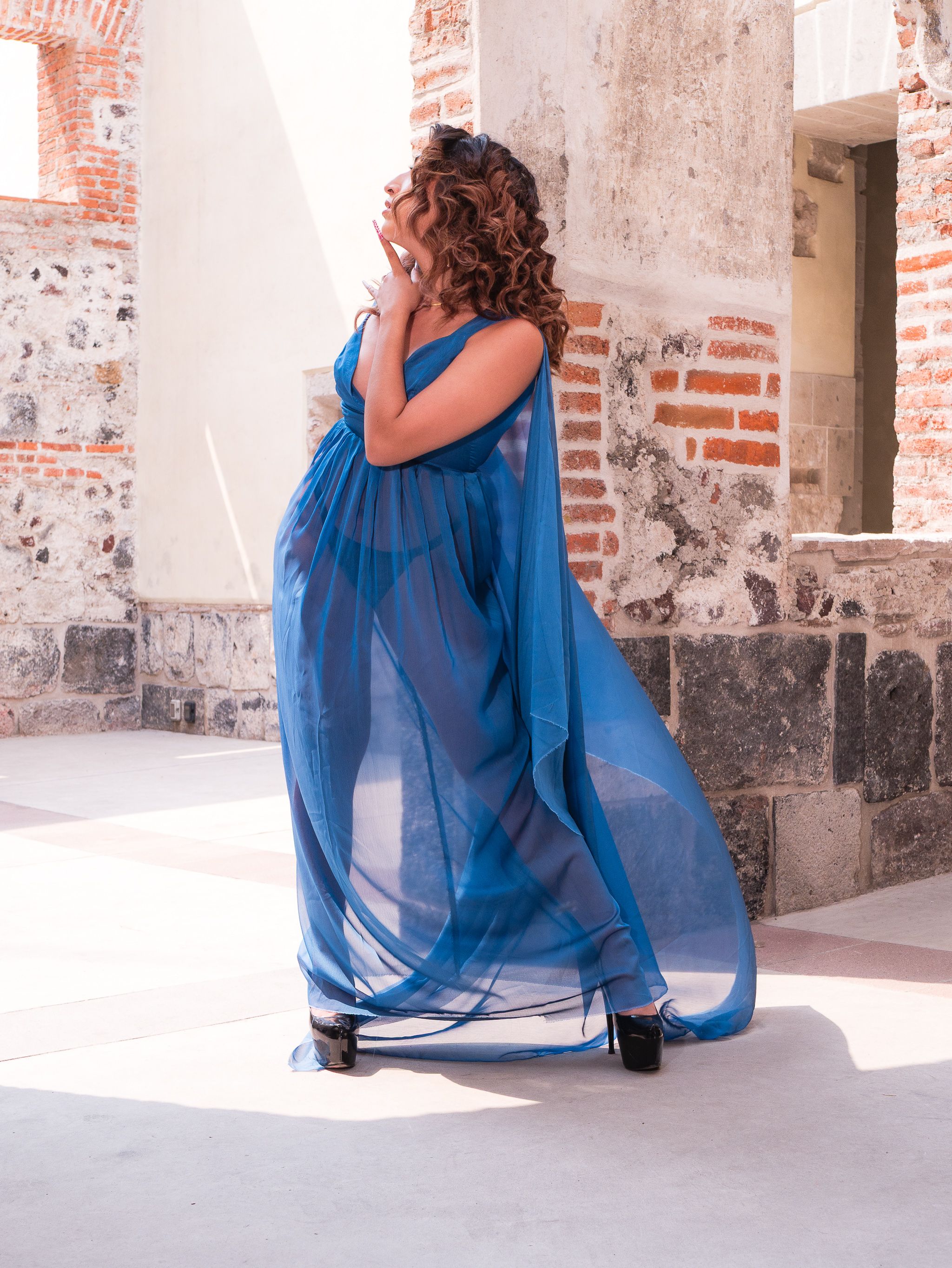 Elegant Woman in Blue Dress at Historic Site · Free Stock Photo