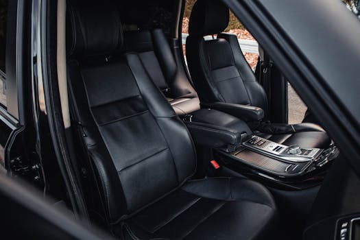Explore a high-end car interior with elegant black leather seats, showcasing luxury and comfort.