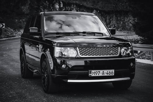 A luxurious black SUV on a winding road near Sarajevo, capturing the essence of adventure and elegance.