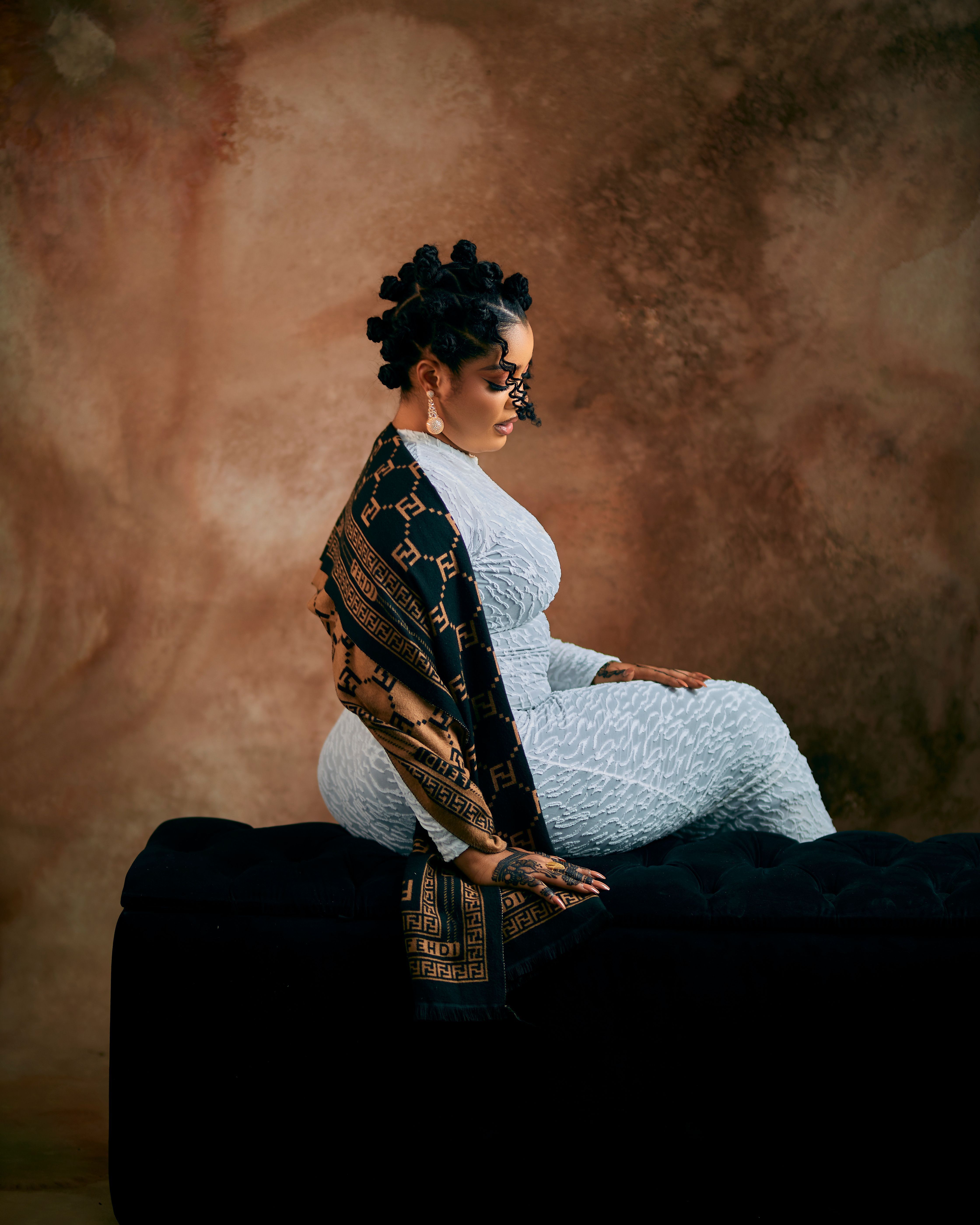 Elegant Woman Seated in Artistic Portrait Pose · Free Stock Photo