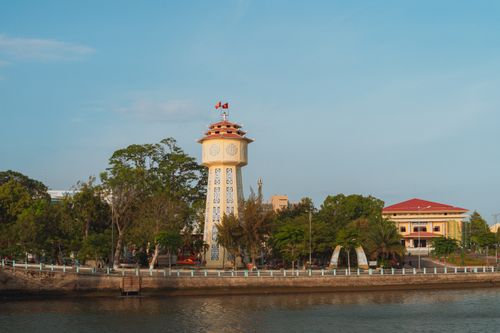 Free Iconic clock tower along the riverside in Bình Thuận, Vietnam, captured on a bright summer day. Stock Photo