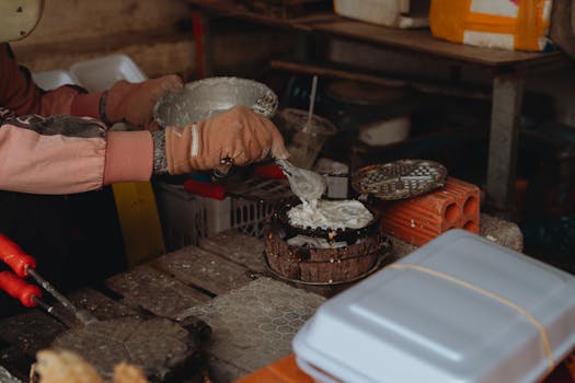 A vendor prepares traditional street food in Bình Thuận, Vietnam depicting local culinary culture.